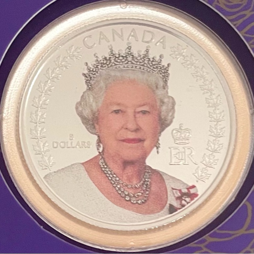 This 99.99% pure silver coin features the official portrait taken in 2010